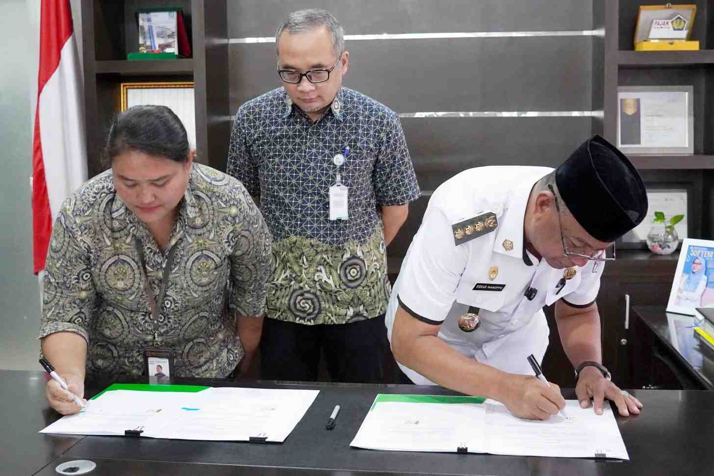 Dokumentasi acara di Kantor BPJS Kesehatan Manado yang dihadiri pejabat Pemkab Boltim dan BPJS.