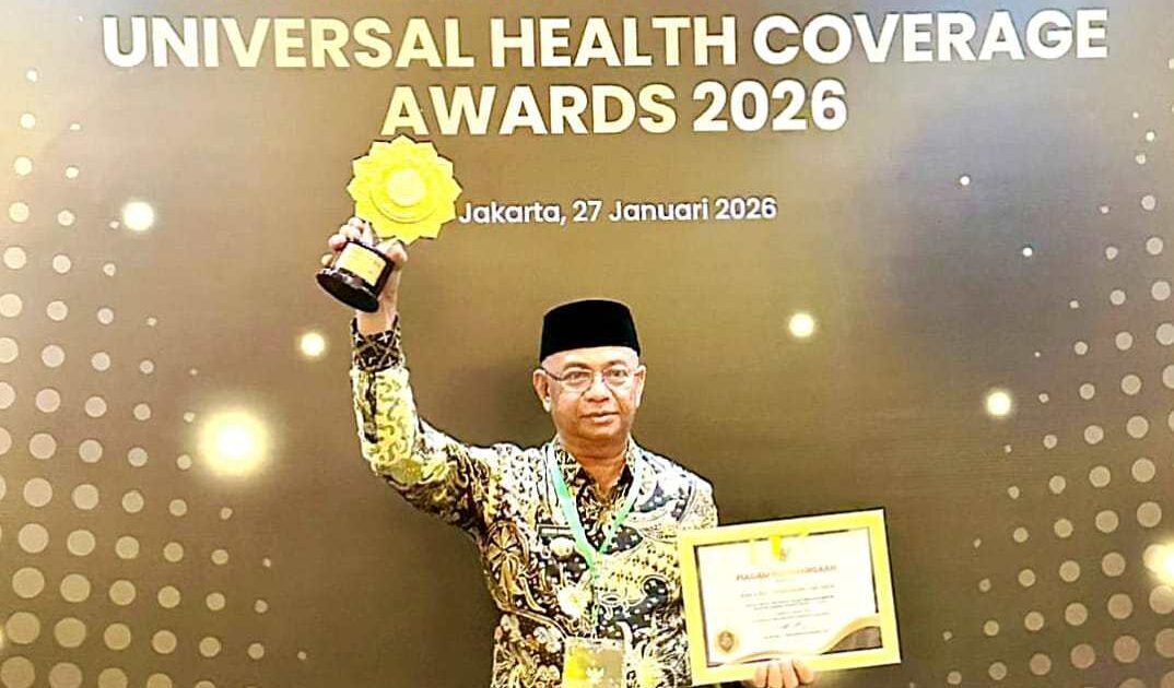 Pemkab Boltim menerima penghargaan UHC kategori Madya 2026