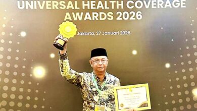 Pemkab Boltim menerima penghargaan UHC kategori Madya 2026